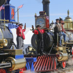 People re-created the historic photo of the meeting of the rails from May 10, 1869, during the commemoration of the 150th anniversary of the Transcontinental Railroad completion at the Golden Spike National Historical Park Friday, May 10, 2019, in Promontory, Utah. (AP Photo/Rick Bowmer)