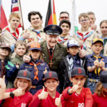 Retired Col. Gail Halvorsen, center, poses with boys and girls as he attends a ceremony to dedicate the baseball and softball field of the Berlin Braves baseball team in 'Gail Halvorsen Park' in Berlin , Saturday, May 11, 2019. Halvorsen is known as the "Candy Bomber," "Chocolate Pilot," and "Uncle Wiggly Wings," for the small candy-laden parachutes he dropped from his aircraft to children during the Berlin Airlift of 1948-1949. (Christoph Soeder/dpa via AP)