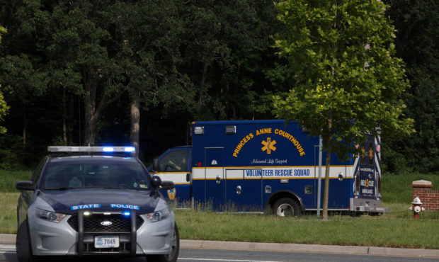 An ambulance turns on Nimmo Parkway following a shooting at the Virginia Beach Municipal Center on ...