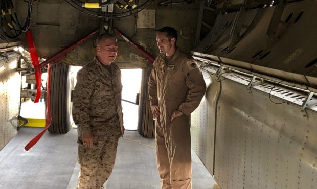 Marine Gen. Frank McKenzie, head of U.S. Central Command, confers with an Air Force officer below t...
