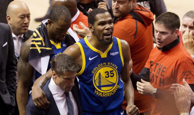 Golden State Warriors forward Kevin Durant (35) reacts as he leaves the court after sustaining an i...