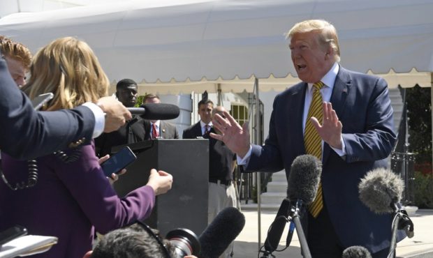 President Donald Trump speaks to reporters on the South Lawn of the White House in Washington, Satu...