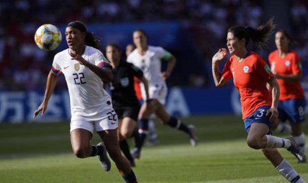 United States' Jessica Mcdonald, left, runs after the ball next to Chile's Carla Guerrero during th...