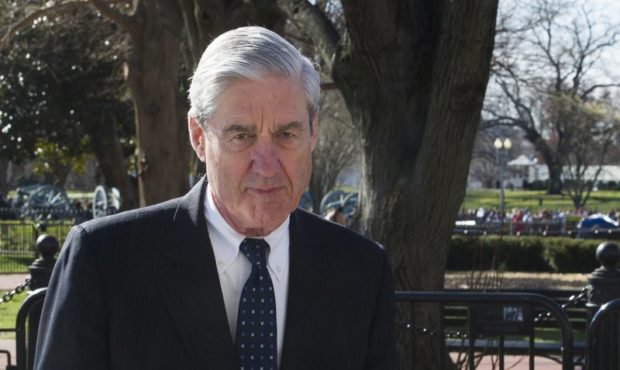 FILE - In this March 24, 2019 photo, then-special counsel Robert Mueller walks past the White House...