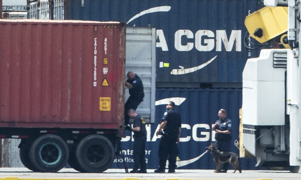 Authorities search a container along the Delaware River in Philadelphia, Tuesday, June 18, 2019. U....