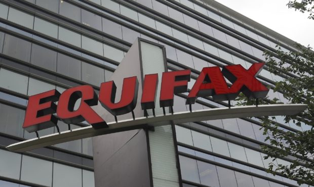 FILE - This July 21, 2012, file photo shows signage at the corporate headquarters of Equifax Inc., ...