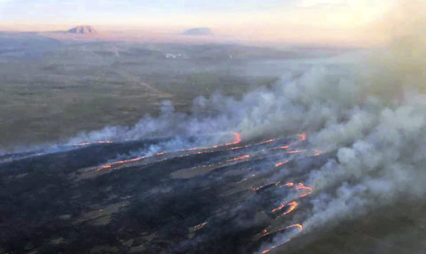 This photo provided by the U.S. Bureau of Land Management (BLM) shows wildfires burning in Idaho, W...
