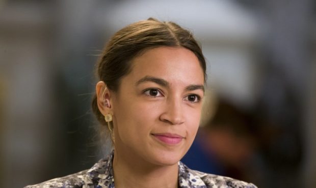 Rep. Alexandria Ocasio-Cortez, D-N.Y., prepares to do a television interview on Capitol Hill, Thurs...