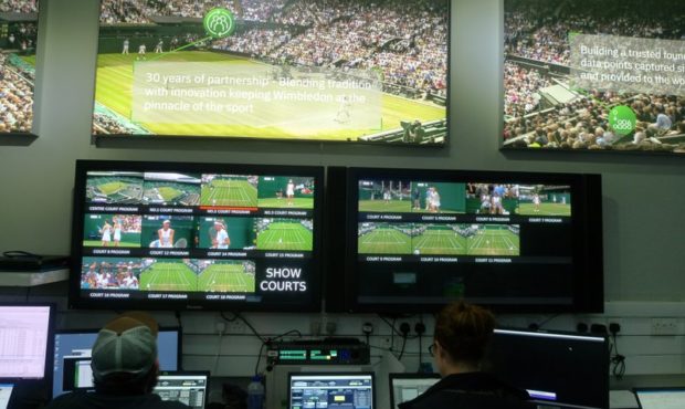 Staff monitor game data and work on match analysis at an operations room during the Wimbledon Tenni...
