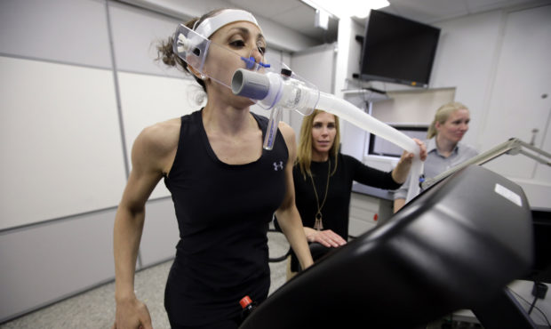 In this April 23, 2019 photo, research scientist Leila Walker, left, is assisted by nutritional phy...