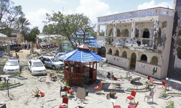 A view of Asasey Hotel after an attack, in Kismayo , Somalia, Saturday July 13, 2019.  At least 10 ...