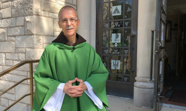 Rev. John Celichowski poses outside of the Saint Clare of Montefalco Catholic Church in Chicago. Hi...
