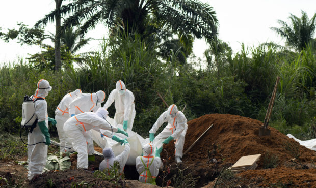 In this photograph taken Sunday July 14, 2019, an Ebola victim is put to rest at the Muslim cemeter...