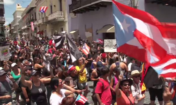 Demonstrators calling for Puerto Rico Gov. Ricardo Rosselló's resignation gathered in streets outs...