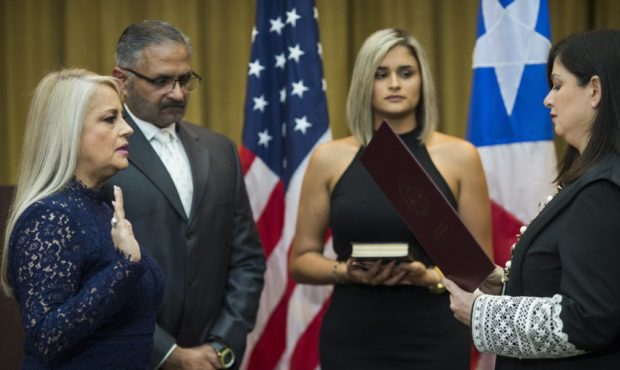 Justice Secretary Wanda Vazquez is sworn in as governor of Puerto Rico by Supreme Court Justice Mai...
