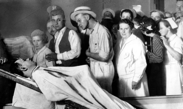 FILE - In this December 1934 file photo, people view the body of gangster John Dillinger in a Chica...
