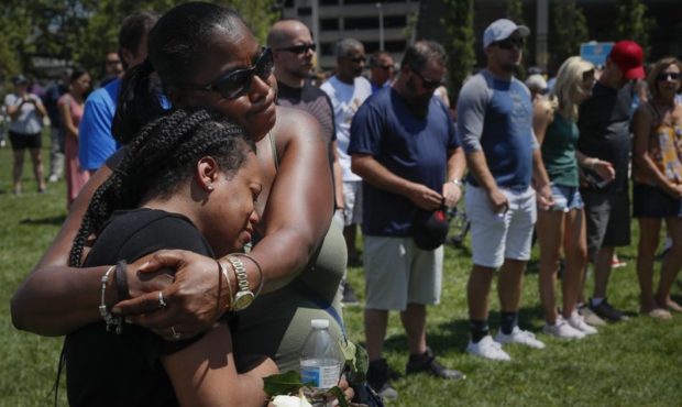 Mourners gather at a vigil following a nearby mass shooting, Sunday, Aug. 4, 2019, in Dayton, Ohio....