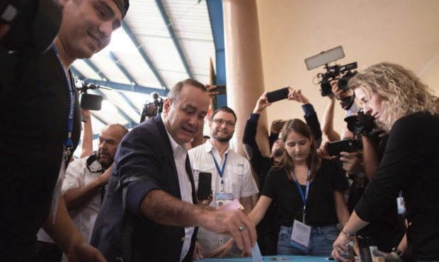 Alejandro Giammattei, presidential candidate of the Vamos party, casts his vote during general elec...
