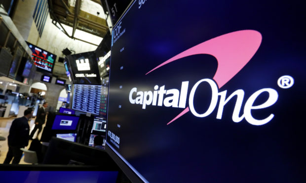 FILE - In this Tuesday, July 30, 2019, file photo, the logo for Capital One Financial appears above...