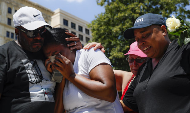 Mourners gather at a vigil following a nearby mass shooting, Sunday, Aug. 4, 2019, in Dayton, Ohio....