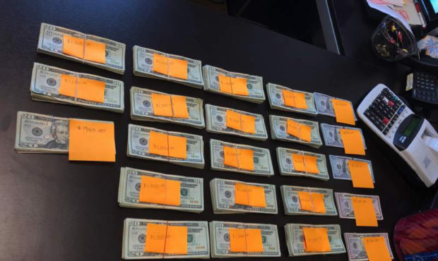 This Friday, Aug. 2, 2019, photo provided by Recology, shows nearly $23,000 in cash discarded at a ...
