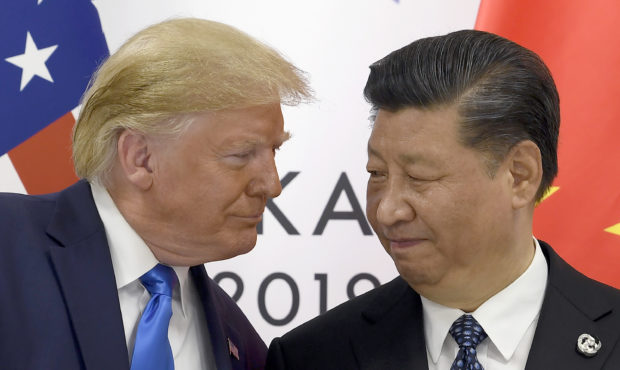 FILE - In this June 29, 2019, file photo, President Donald Trump, left, meets with Chinese Presiden...