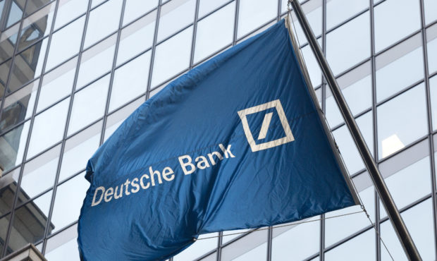 FILE - In this Oct. 7, 2016, file photo a flag for Deutsche Bank flies outside the German bank's Ne...