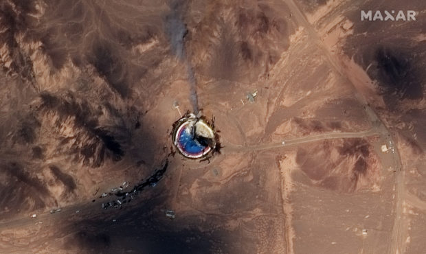 This satellite image from Maxar Technologies shows a fire at a rocket launch pad at the Imam Khomei...