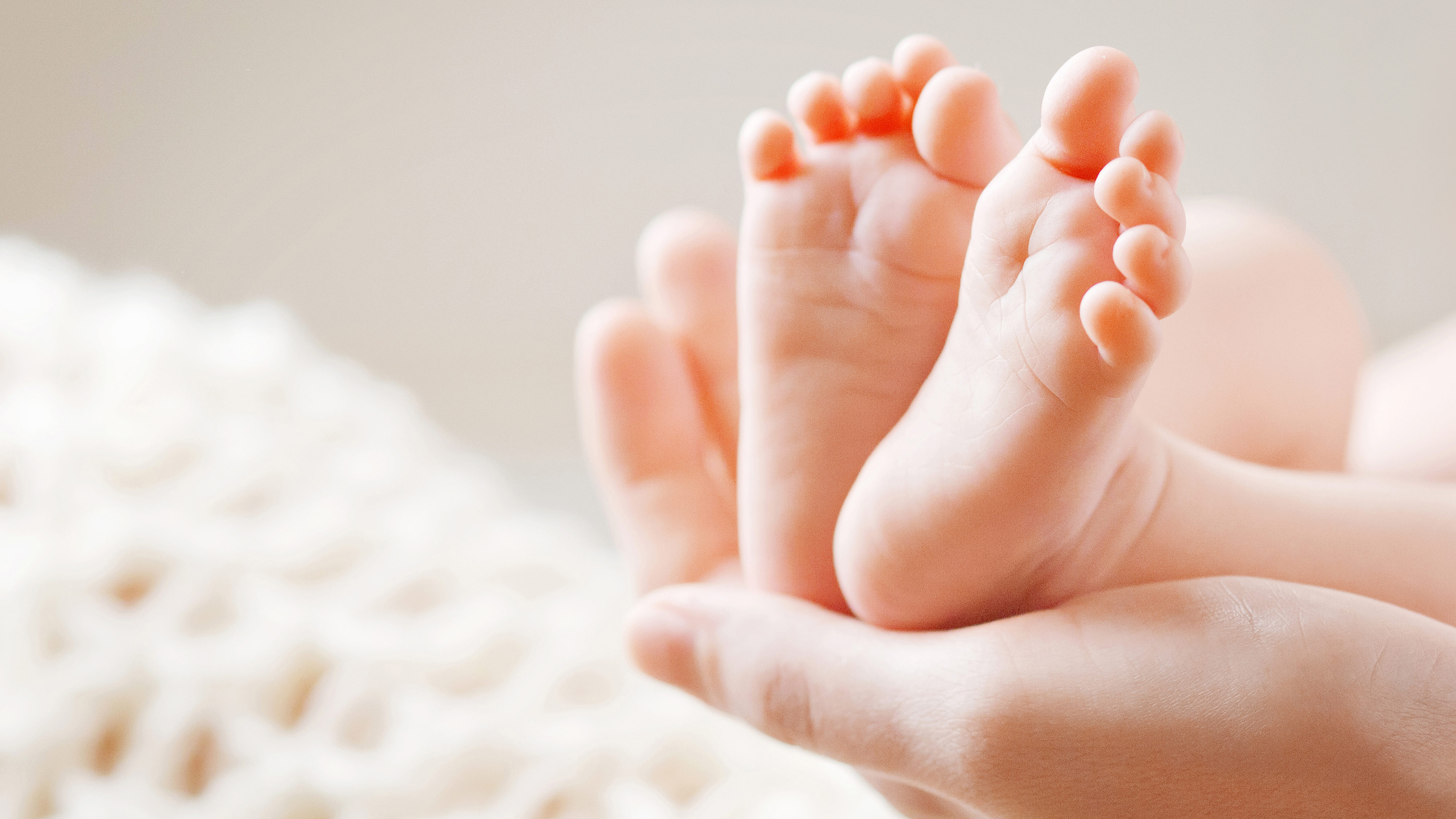 baby feet pictured, utah fertility rates are dropping...