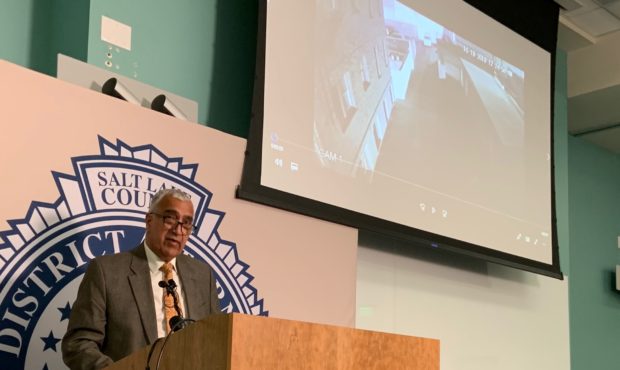 (Salt Lake County DA Sim Gill, showing footage from the October shooting.  Credit: Paul Nelson)...