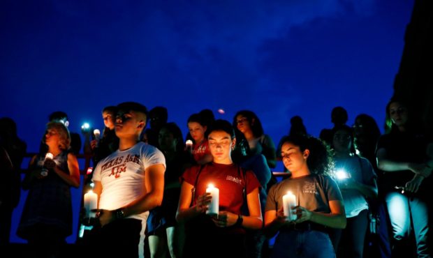 From left, Samuel Lerma, Arzetta Hodges and Desiree Quintanar attend a vigil for victims of the dea...