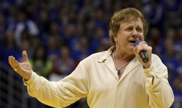 FILE - In this Jan. 25, 2010 file photo, Eddie Money sings the national anthem before an NCAA colle...