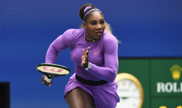 Serena Williams, of the United States, dashes to the net on a return to Petra Martic, of Croatia, d...