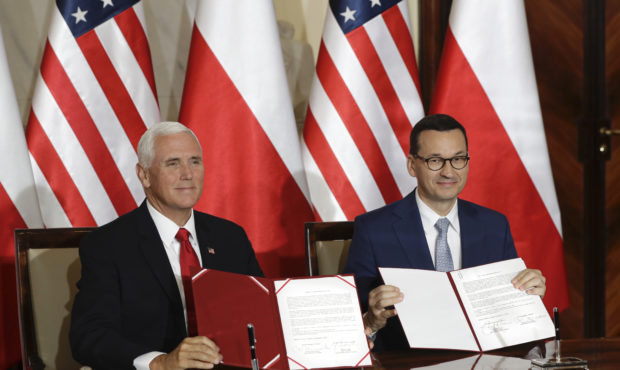U.S. Vice President Mike Pence and Polish Prime Minister Mateusz Morawiecki display an agreement th...