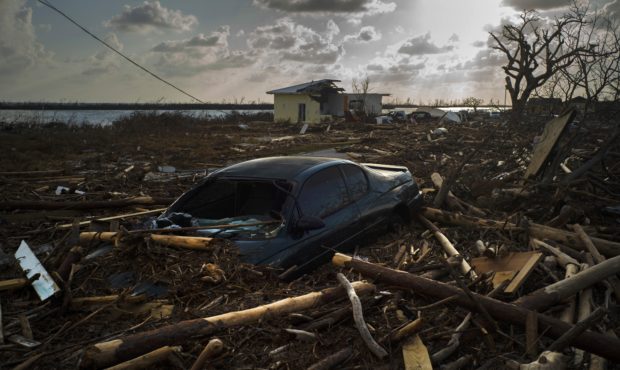 A car is sunk in the wreckage and debris caused by Hurricane Dorian, in Mclean's Town, Grand Bahama...