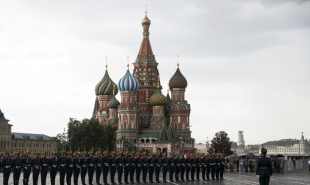 FILE - In this June 30, 2018, file photo, Kremlin guards perform in Red Square with St. Basil's Cat...