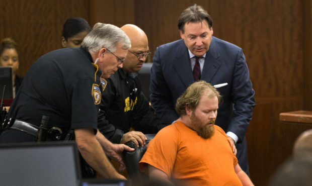 FILE - In this July 11, 2014 file photo, Ronald Lee Haskell collapses as he appears in court in Hou...
