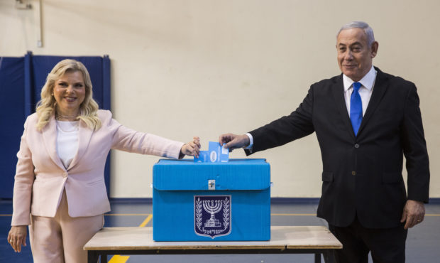 Israeli Prime Minister Benjamin and his wife Sarah casts their votes at a voting station in Jerusal...