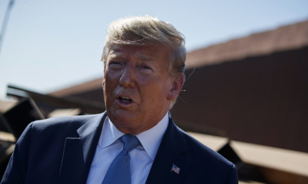 President Donald Trump talks with reporters after touring a section of the southern border wall, We...