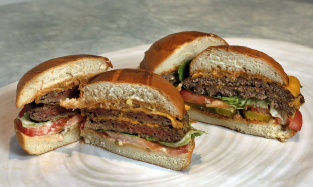 FILE - This Friday, May 3, 2019 file photo shows an Original Impossible Burger, left, and a Cali Bu...