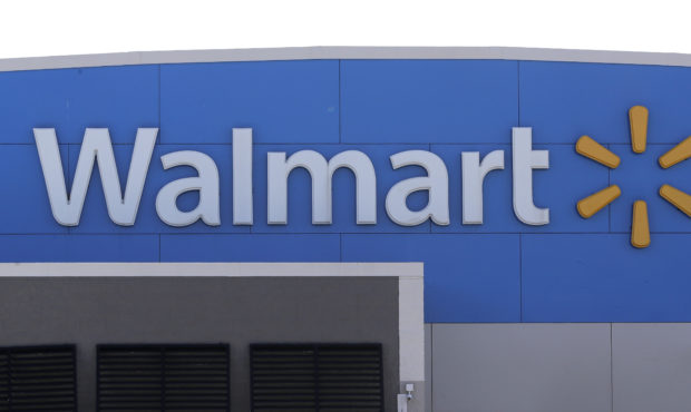 FILE - In this Sept. 3, 2019 file photo, a Walmart logo is displayed outside of a Walmart store.  (...
