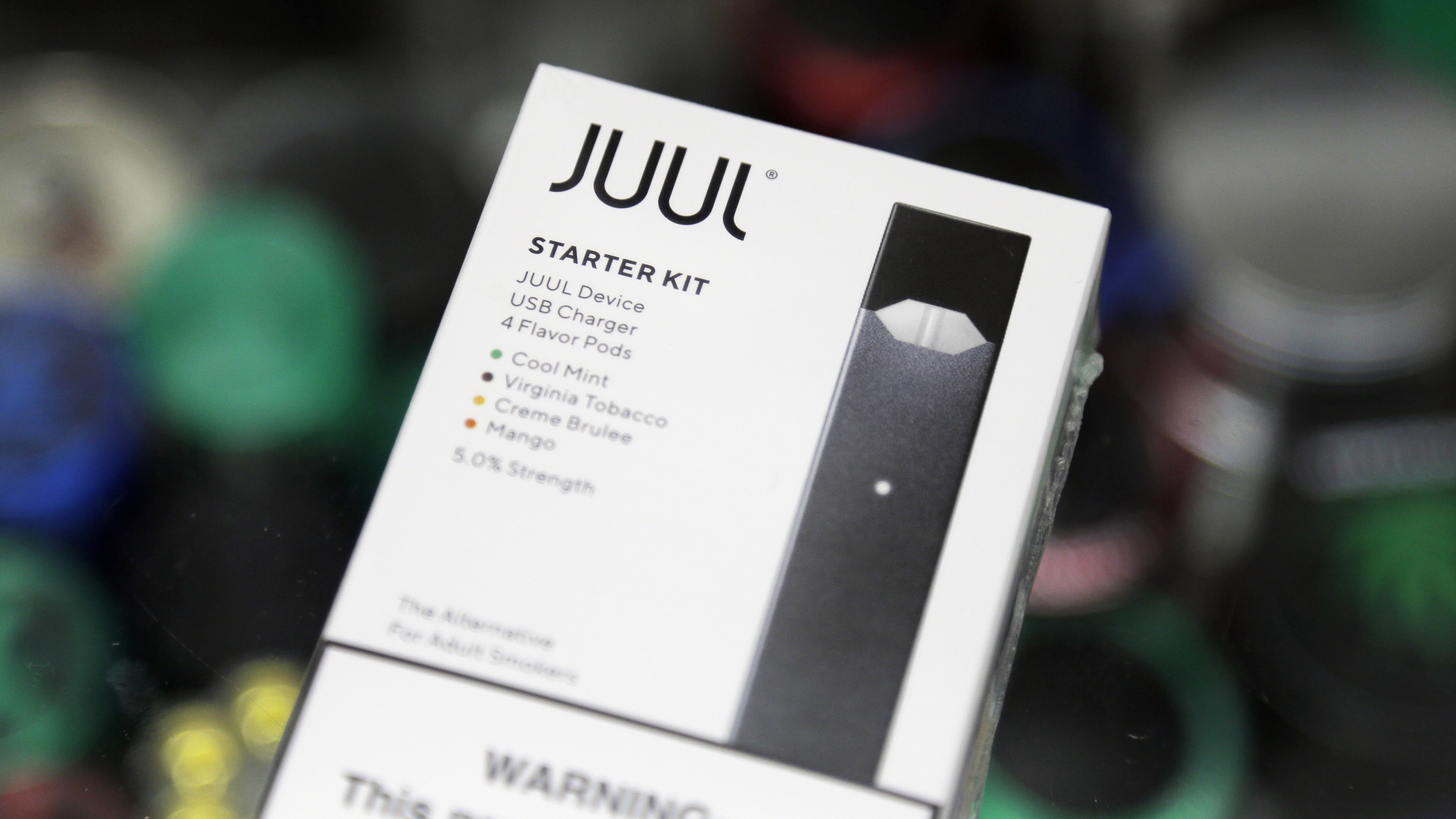 FILE - This Dec. 20, 2018, file photo shows a Juul electronic cigarette starter kit at a smoke shop...