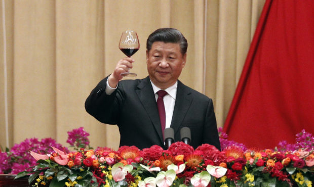 Chinese President Xi Jinping makes a toast after delivering his speech at a dinner marking the 70th...