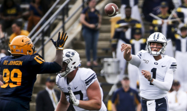 Brigham Young Cougars quarterback Zach Wilson (1) completes a pass during the first half of an NCAA...