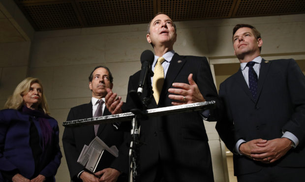 Rep. Adam Schiff, D-Calif., second from right, speaks with members of the media after former deputy...