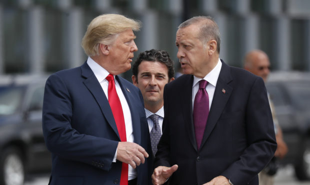 FILE - In this Wednesday, July 11, 2018, file photo, President Donald Trump, left, talks with Turke...