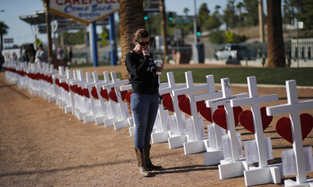 Jill Hale stands at a makeshift memorial for shooting victims, Tuesday, Oct. 1, 2019, in Las Vegas,...