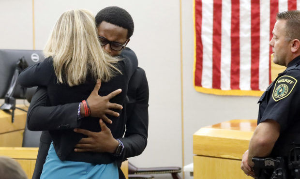 Botham Jean's younger brother Brandt Jean hugs convicted murderer and former Dallas Police Officer ...