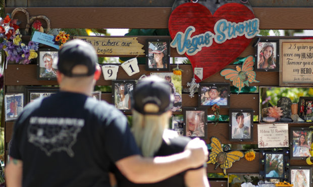 People visit a memorial garden for victims of a mass shooting in Las Vegas, Thursday, Oct. 3, 2019,...