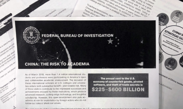 This Oct. 4, 2019 photo shows a copy of an FBI pamphlet and related emails. The FBI’s outreach to...